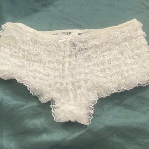 Woman’s small white ruffled panties  adorable and sexy